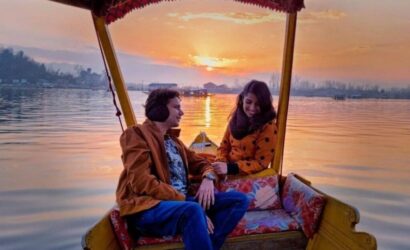 Romantic honeymoon couple enjoying shikara ride in Dal Lake Kashmir