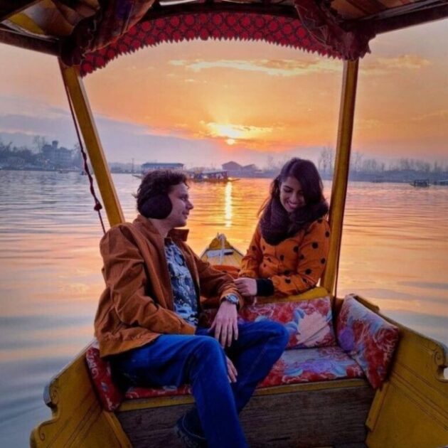 Romantic honeymoon couple enjoying shikara ride in Dal Lake Kashmir